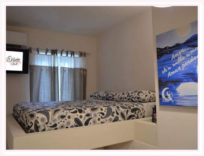 camera-matrimoniale-luna-bed and breakfast-cielididante-conversano-1-letto-travi-legno